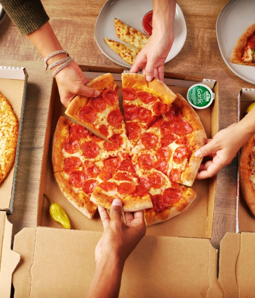 Friends eating Pizza at Papa John's Pizza Boone NC Image from Facebook